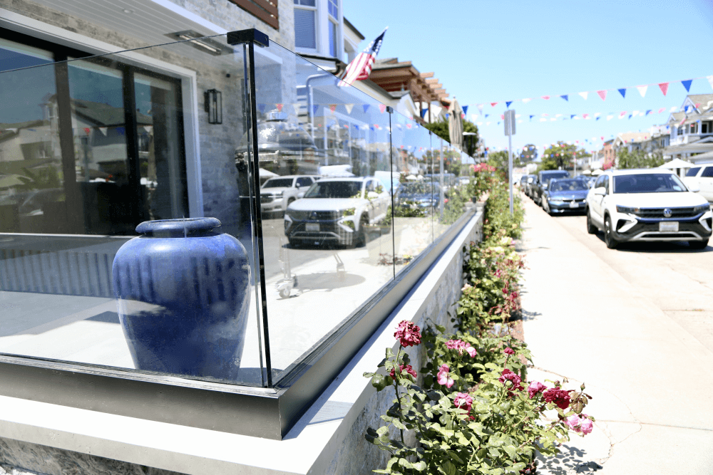 Glass-railing-installation-on-beach-house-wind-wall.png