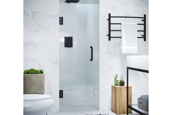 A close-up photo of a Frameless Clear Glass Shower Door in a luxury bathroom